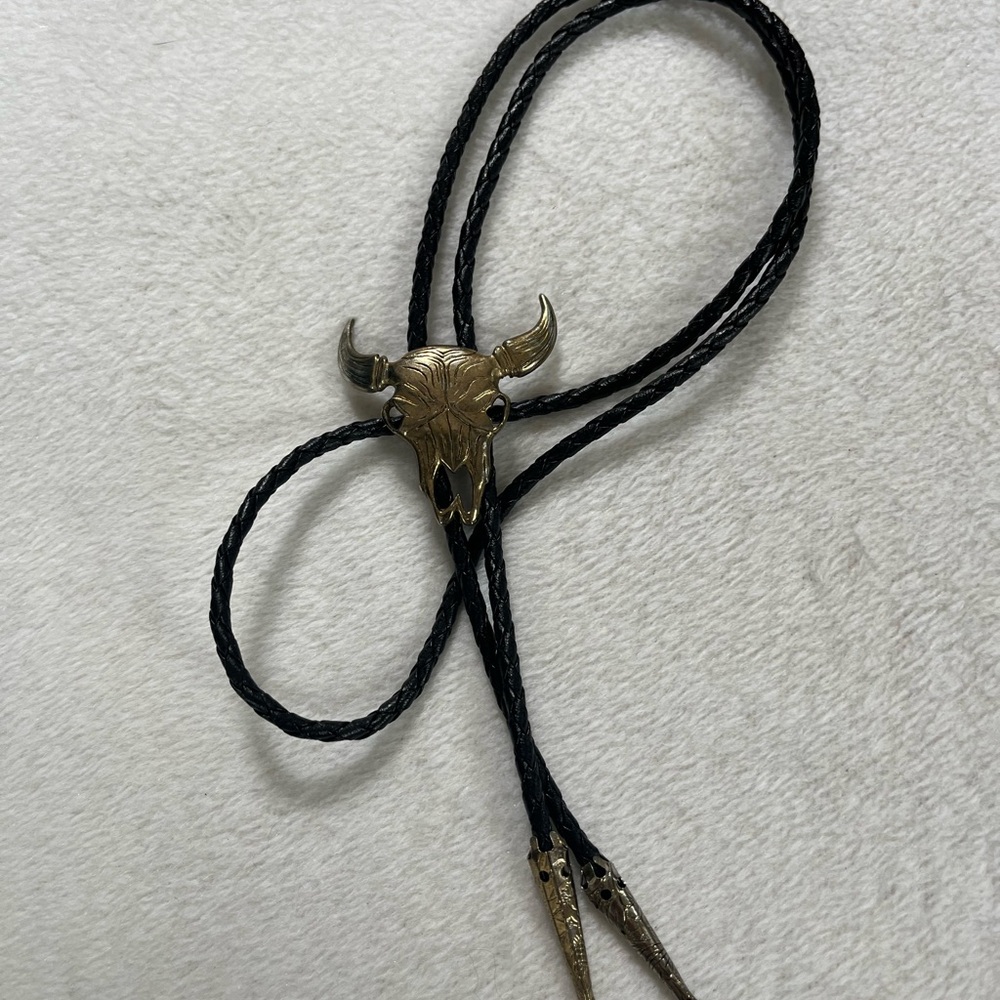 Vintage Western Black and Gold Bolo Tie with Bull Skull